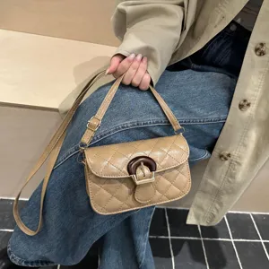 Chic quilted shoulder bag for women, elegant faux leather crossbody purse with unique wooden buckle design.