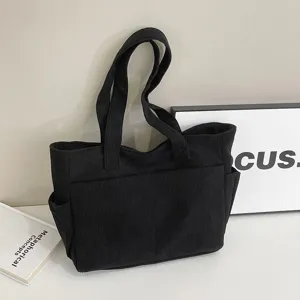 Classic black corduroy tote bag, large capacity shoulder bag for daily commute and casual use.
