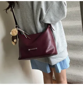 Chic wine red underarm bag for women, trendy leather shoulder crossbody bag with cute bear.