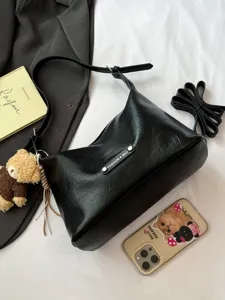 Chic black PU leather underarm shoulder bag for women, stylish versatile crossbody bag.