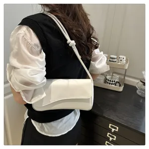 Chic French style minimalist white underarm shoulder bag detail, perfect for daily commute.