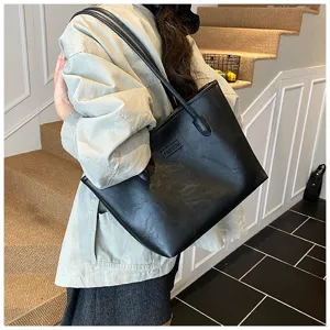 Black oil wax leather tote bag women commuter large capacity shoulder underarm bag detail view.
