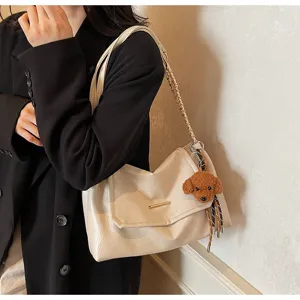 Koreaanse stijl retro schoudertas voor dames herfst nieuwe trend tas met pluche hond hanger.
