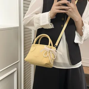 Chic yellow women handbag with pearl bow, stylish single shoulder messenger small bag for daily.