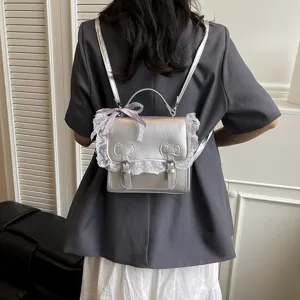 Korean style sweet college silver backpack with lace trim and bows worn on back main view.
