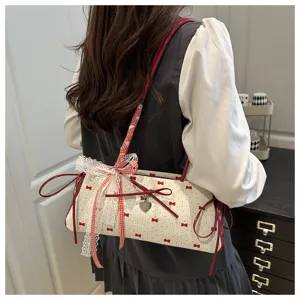 Detailed shot of a sweet bow shoulder bag worn on a model, highlighting the elegant design.