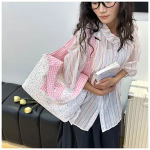Close-up detail of Korean style vintage pink floral and plaid canvas shoulder tote bag.