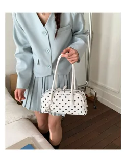 Cute polka dot pillow handbag for women, trendy white shoulder bag with star charm.