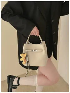 Elegante Leder Eimer Handtasche für Damen, Retro Mode Umhängetasche mit Drehverschluss.
