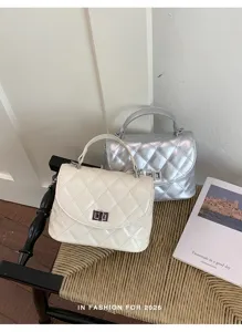Chic quilted women's handbag set, stylish metallic and off-white shoulder crossbody bags.