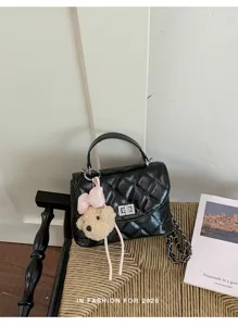 Classic quilted women's shoulder bag with chain strap and cute bear pendant accessory.