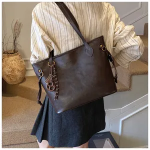 Minimalist dark brown commuter tote bag for women, large capacity shoulder bag for daily use.