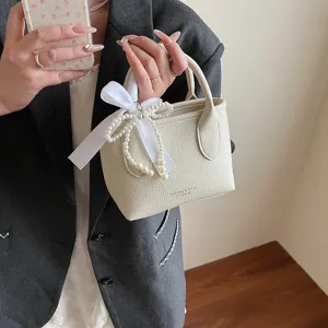 Chic borsa a secchiello beige da donna, elegante borsa con nastro di perle per lavoro.