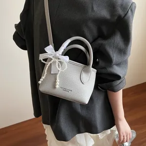 Borsa a secchiello grigia monocolore minimalista da donna con nastro di perle vista principale