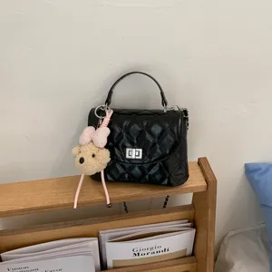 Chic quilted women shoulder bag with cute bear pendant, stylish chain crossbody handbag.