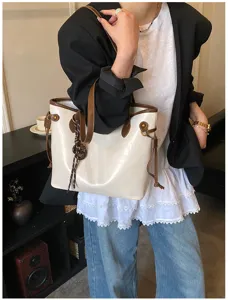 Detailed view of stylish women commuter tote bag, large capacity PU leather shoulder bag.