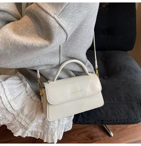 Elegant women solid color PU leather top handle shoulder bag with adjustable crossbody strap.