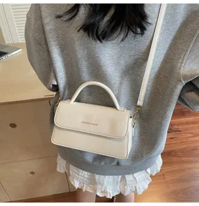 Trendy white leather crossbody bag for women, chic shoulder handbag for daily commuting.