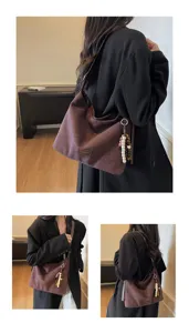 Vintage brown suede shoulder bag for women, stylish hobo tote with beaded charm for daily.