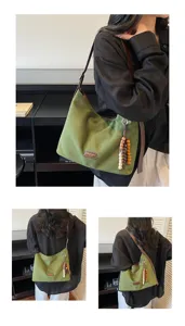 Vintage green suede hobo shoulder bag for women, casual commuter underarm tote with bead charm.