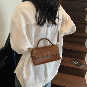 Stylish women brown shoulder bag PU leather crossbody handbag with top handle for autumn.