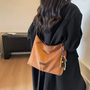 Vintage faux suede shoulder bag for women, stylish underarm hobo bag with wooden beads.