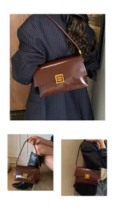 Vista dettagliata della elegante borsa a spalla in vera pelle oliata con chiusura quadrata.