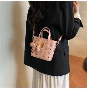Pink mini bucket bag with cute bear pattern and chain, stylish leather shoulder crossbody bag.