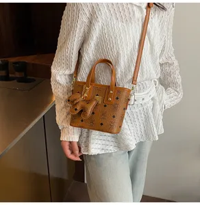 Korean style vintage brown bucket bag with top handle and crossbody strap, chic daily tote for women