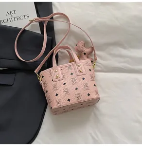 Korean style vintage pink bucket bag with cute bear pattern, crossbody and handbag design.