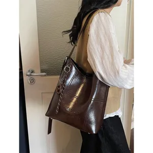 Brown patent leather tote bag for women, large capacity chic shoulder bag for daily commute.
