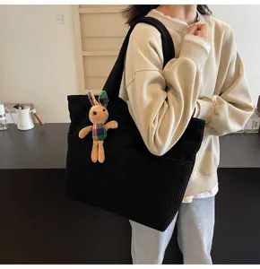 Black corduroy tote bag with cute rabbit pendant, large capacity casual commuter handbag.