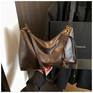 Retro dark brown shoulder bag for women, soft PU leather hobo bag with chic gold hardware.