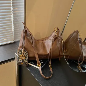 Brown retro slouchy shoulder bag for women, minimalist daily crossbody hobo bag style.