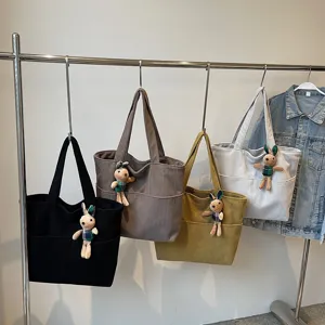 Women striped velvet tote bag with cute rabbit pendant, casual large capacity commuter handbag.