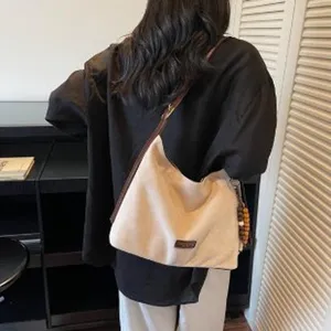 Retro suede shoulder bag for women, trendy autumn hobo casual daily commuter handbag.