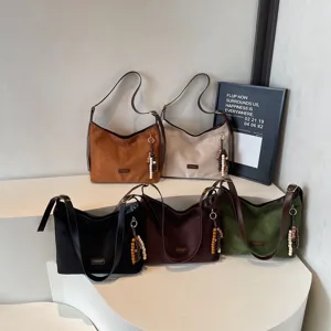 Vintage suede leather shoulder bag for women, trendy commuter underarm hobo bag.