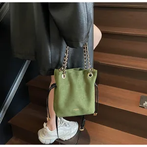 Vintage green suede bucket bag for women, stylish chain drawstring tote and casual crossbody.