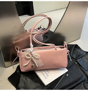 Pink PU leather shoulder bag for women, stylish underarm bag with elegant pearl lace bow.