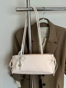 Minimalist PU leather shoulder underarm bag with elegant pearl bow charm for women daily chic