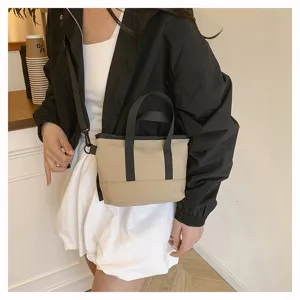 Casual solid color mini canvas crossbody bag for women, Japanese style shoulder bag.