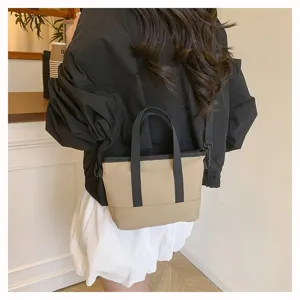 Casual solid color crossbody small canvas bag detail view, minimalist style shoulder bag for daily use.