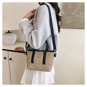Casual solid color canvas crossbody shoulder bag for women, trendy daily small handbag.