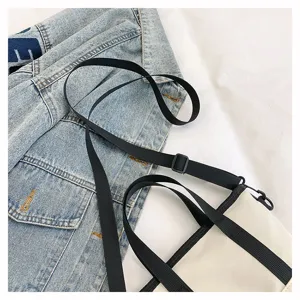 Casual white canvas crossbody bag with black straps, minimalist daily shoulder bags.