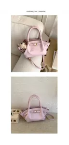 Pink women handbag trendy shoulder crossbody bag with belt detail and cute bear charm style.