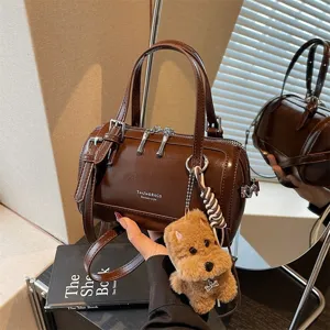 Retro oil-wax leather barrel handbag for women, stylish brown shoulder crossbody bag chic.