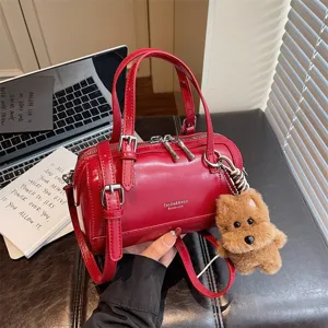 Vintage red oil-wax leather barrel handbag for women, stylish chic crossbody pillow bag.
