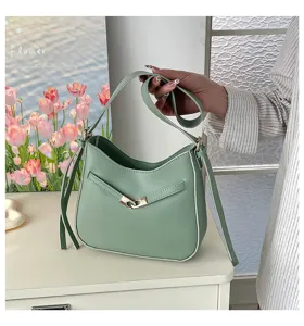 Green PU leather bucket shoulder bag, retro design with metal clasp, casual daily commute style.