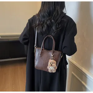 Vintage brown leather tote bucket bag with cute bear keychain for women autumn fashion shoulder bag