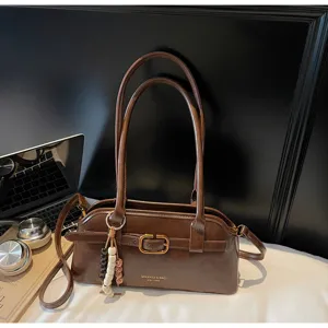 Brown leather underarm shoulder bag with double handles and vintage buckle detail